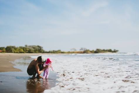 beach baby here comes a wave