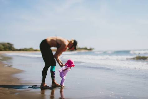 beach baby luna running to water