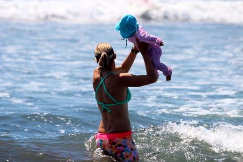 I'm helping her learn how to jump over waves. She loves it!